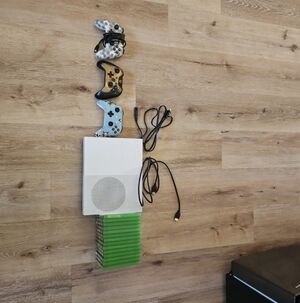 White Gaming Console with Controllers and Games